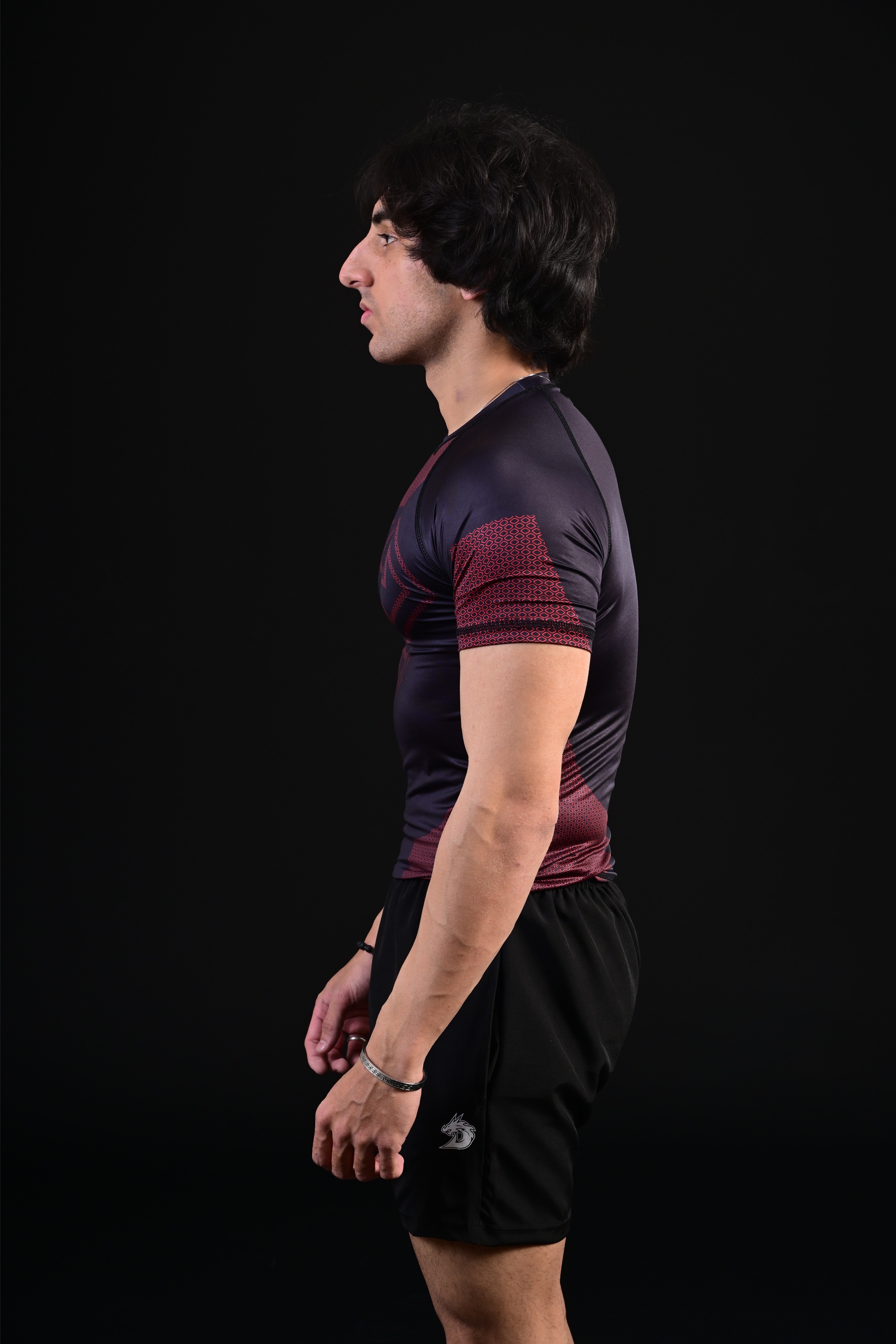Athletic black Superman compression top training performance