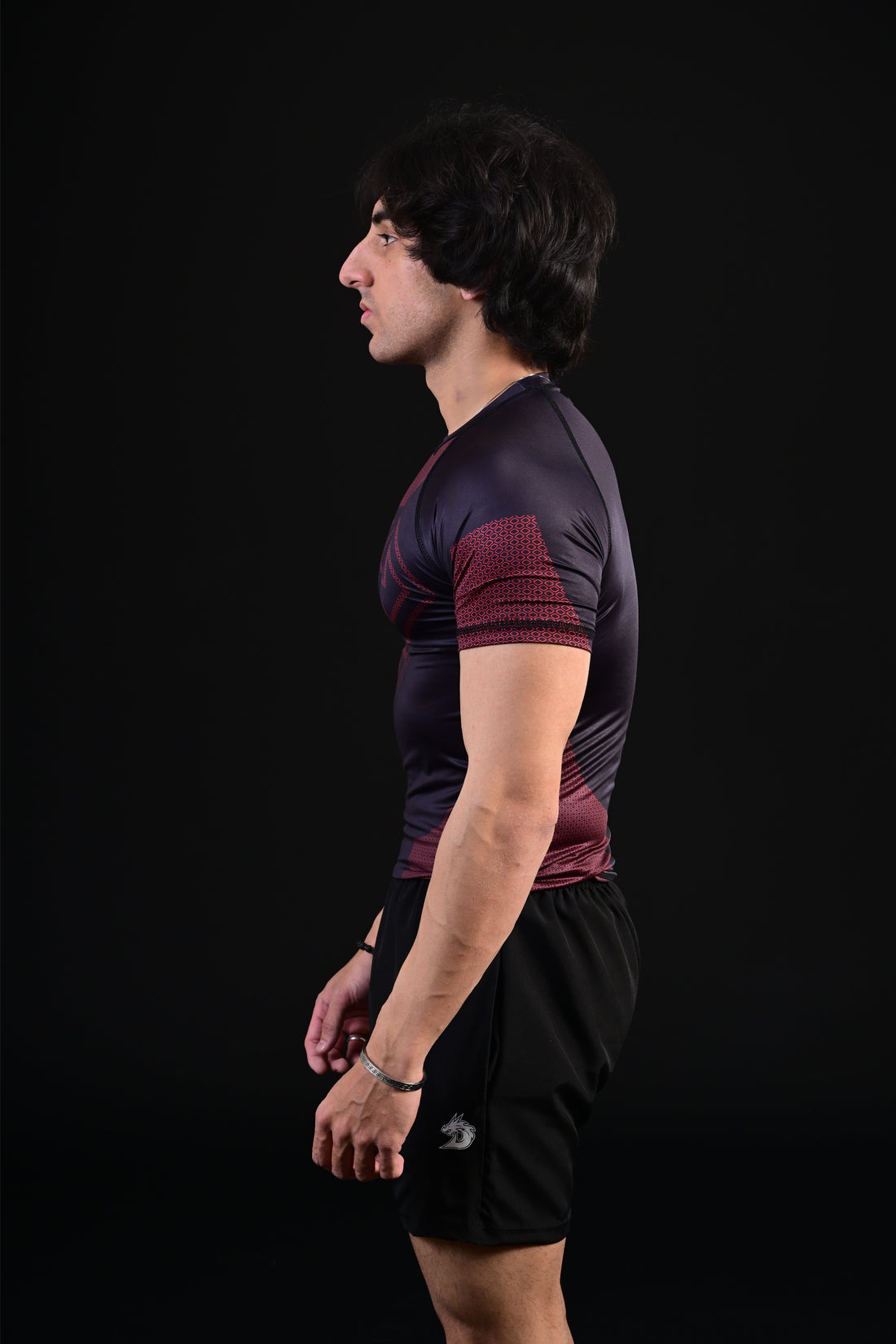 Athletic black Superman compression top training performance